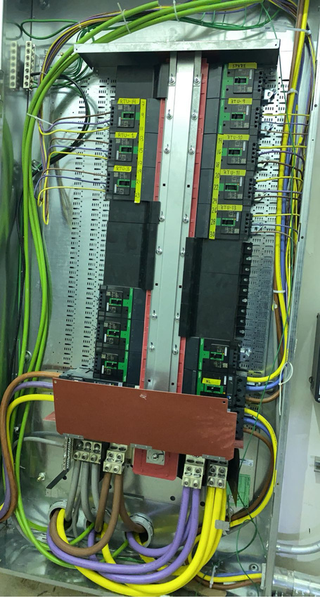 Open electrical distribution panel with organized wiring